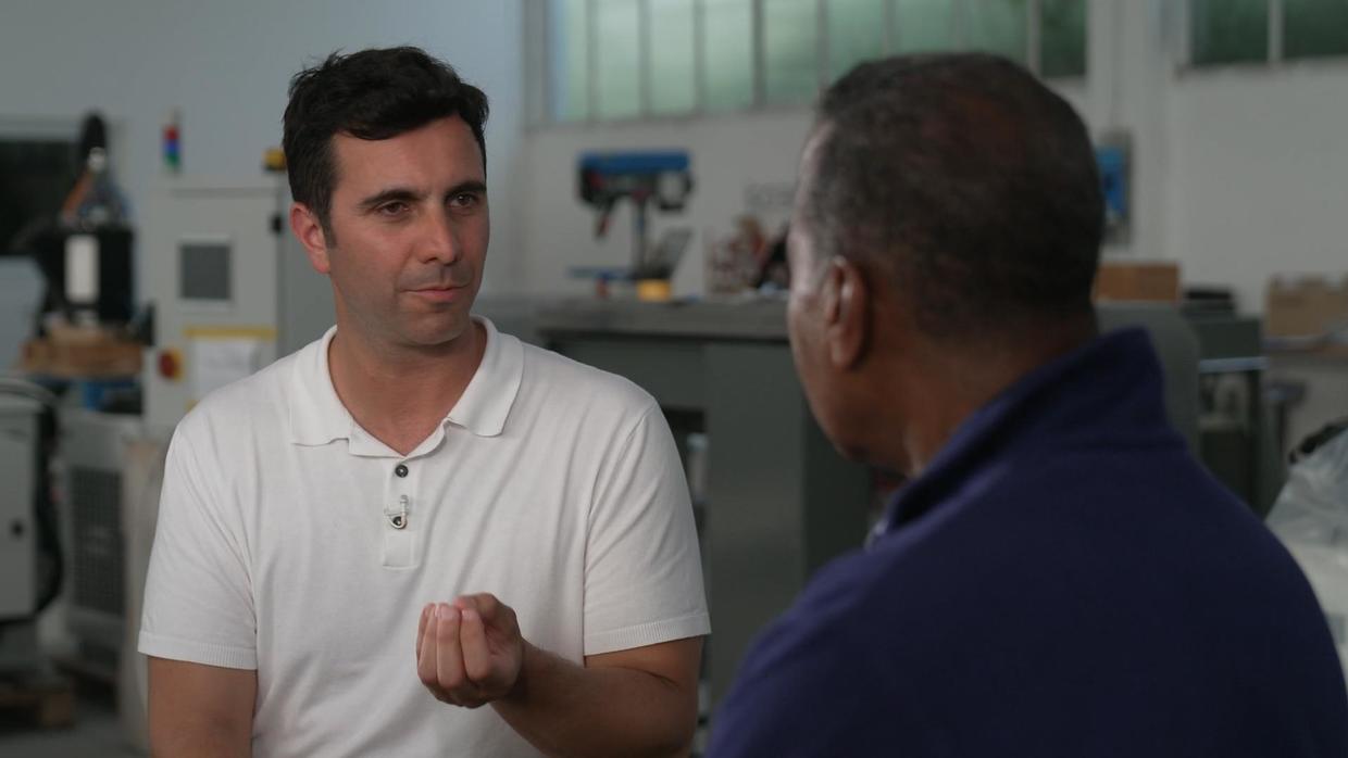 CBS journalist Bill Whitaker and Giacomo Massari